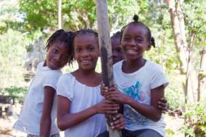 Fourth graders Nadia, Ruth, and Clarancia.