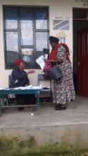 Parents exchanging distance learning work