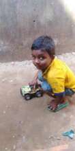 Tamjid with his favorite toy car