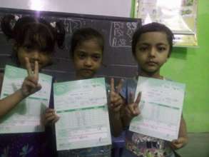 Holding their report cards