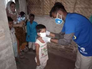 Think Tank member affixes a mask - 2