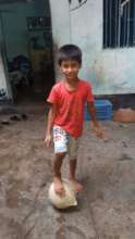 Farha playing outside her home
