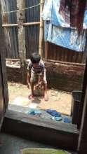 Jihad playing outside his home
