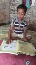 Jihad studying from his new book