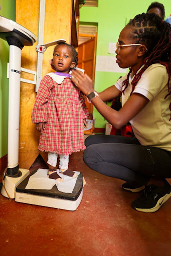 Our nutritionist, monitoring Sheilah's growth