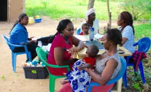 Nurses assisting Mothers with Children at MCH
