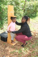 A health officer conducting nutrition assessment