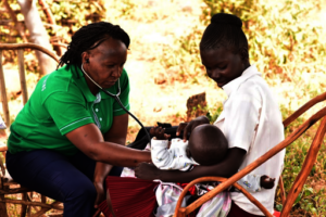 Nurses attending a child during an MCH Clinic