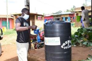 HopeCore staff distributing soap to a market