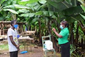 A CHV training a family member COVID 19
