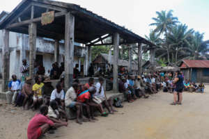 Holding a community meeting to talk about findings