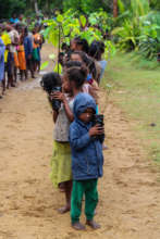 Kids at Club Atsatsaky planting fruit trees