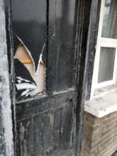 Broken door in a UK accommodation centre