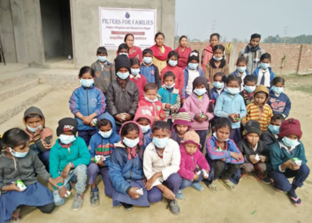 Young school children wearing masks after workshop