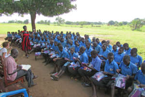 Ogwancan girls receiving sanitary pad kits in June
