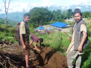 Men digging trench for water pipeline