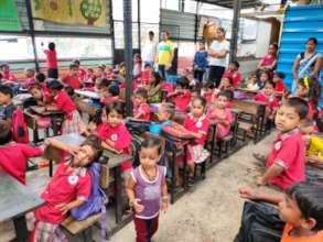 TCS Employees distributing gifts to our tinytots