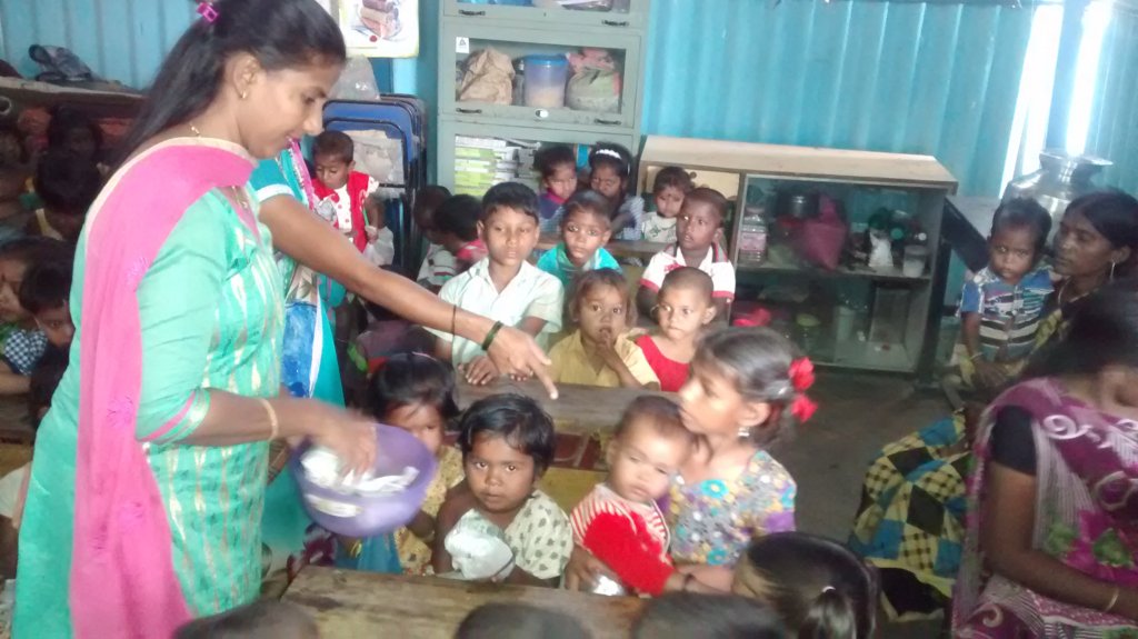 Sweets being distributed to our Tiny-tots