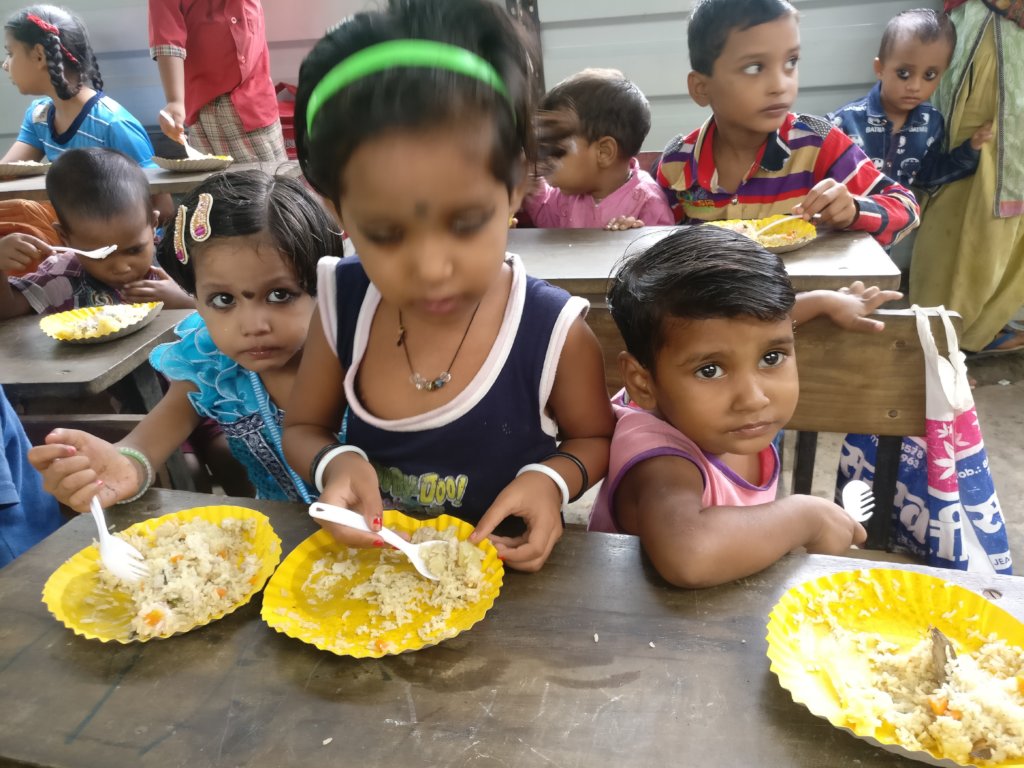 Tiny-tots enjoying sumptuous Bday meal
