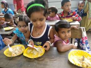 Tiny-tots enjoying sumptuous Bday meal