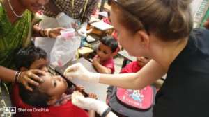 Deworming /Vitamin-A being administered