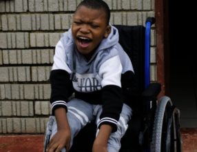 Rethabile receiving his wheelchair