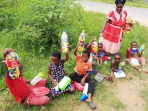 Kids collecting Tops and Tags from Fiso's village