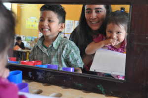 Students examining their smiles in the mirror
