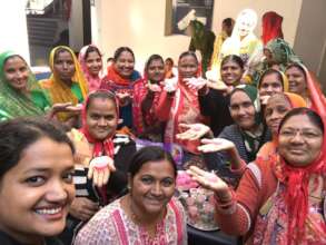 Women attending a candle-making workshop