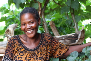 Neema stands in her Forest Garden