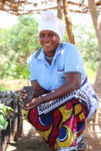 A farmer ready to plant her seedling