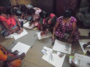Beneficiaries engaged in drawing activity