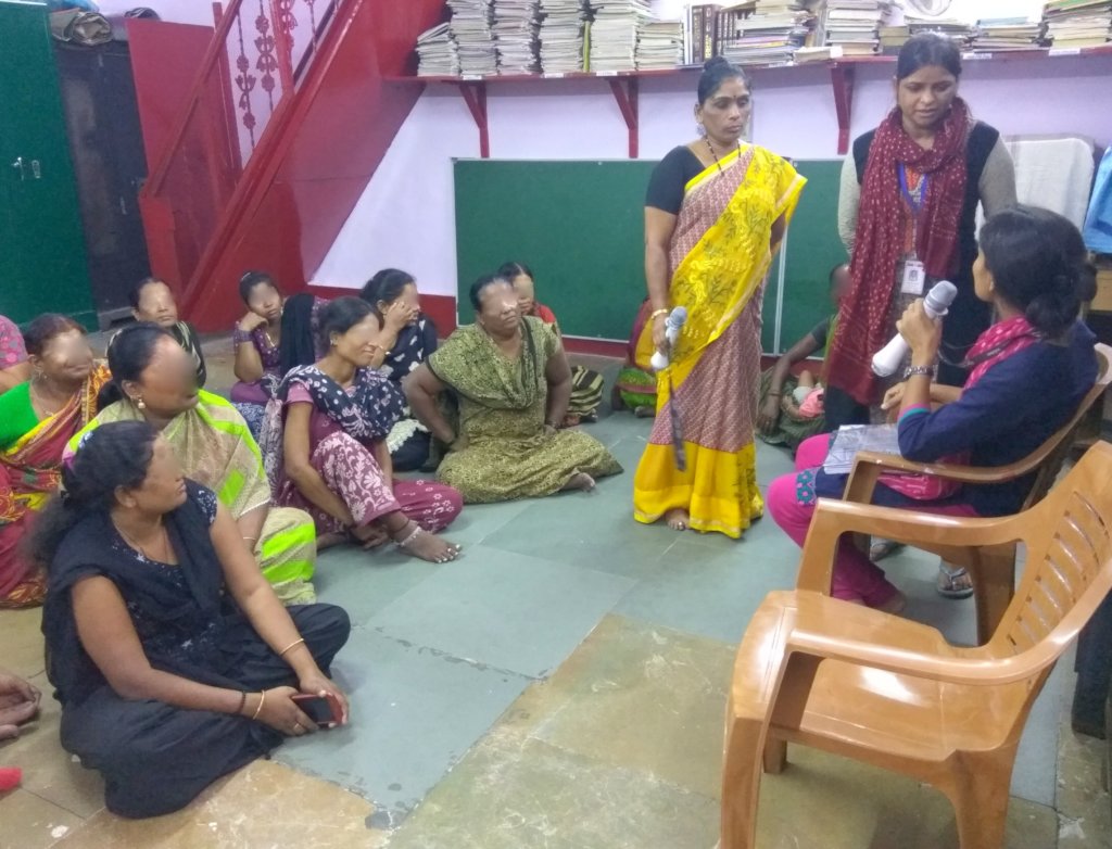 Outreach team conducting a skit for Umeed women
