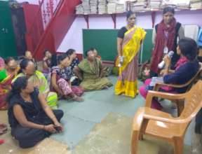 Outreach team conducting a skit for Umeed women