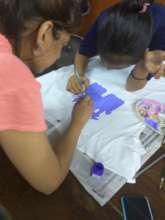 a mentor-mentee session on T-shirt painting