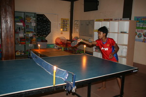 Ping pong by candlelight at Grace House Youth Club