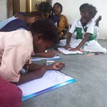Young girls drawing together after school