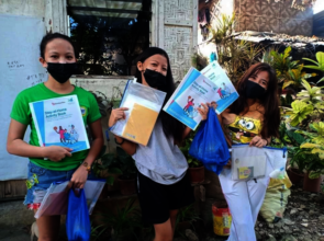 Girls with their Learn from home packs