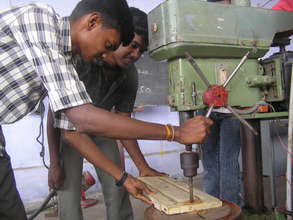 A trainee learning carpentry skills