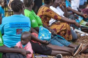 Women hold their DfG Kits during health training