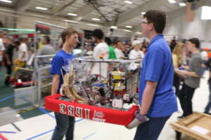 Robotics team members setting up
