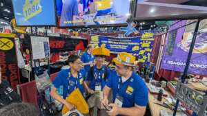 FRC Mentor working with students in the pits