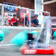FRC teams navigate the playing field.