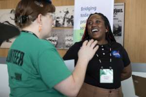 Volunteer chats with Championship Exhibitor