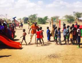 Children lining up to try the new playground