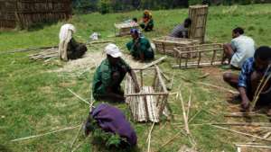 Trainees learning how to make beehives