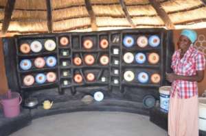 Anna's dishes, stove and clean water buckets