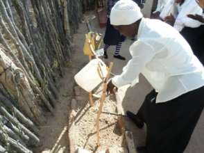 A woman demonstrates proper hand washing