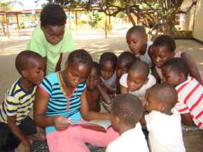 Children reading Biblionef books