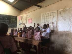 Damian observes & joins in w/ pupils of a P1 class